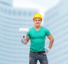 عکس با کیفیت  کارگر و غلطک در دست